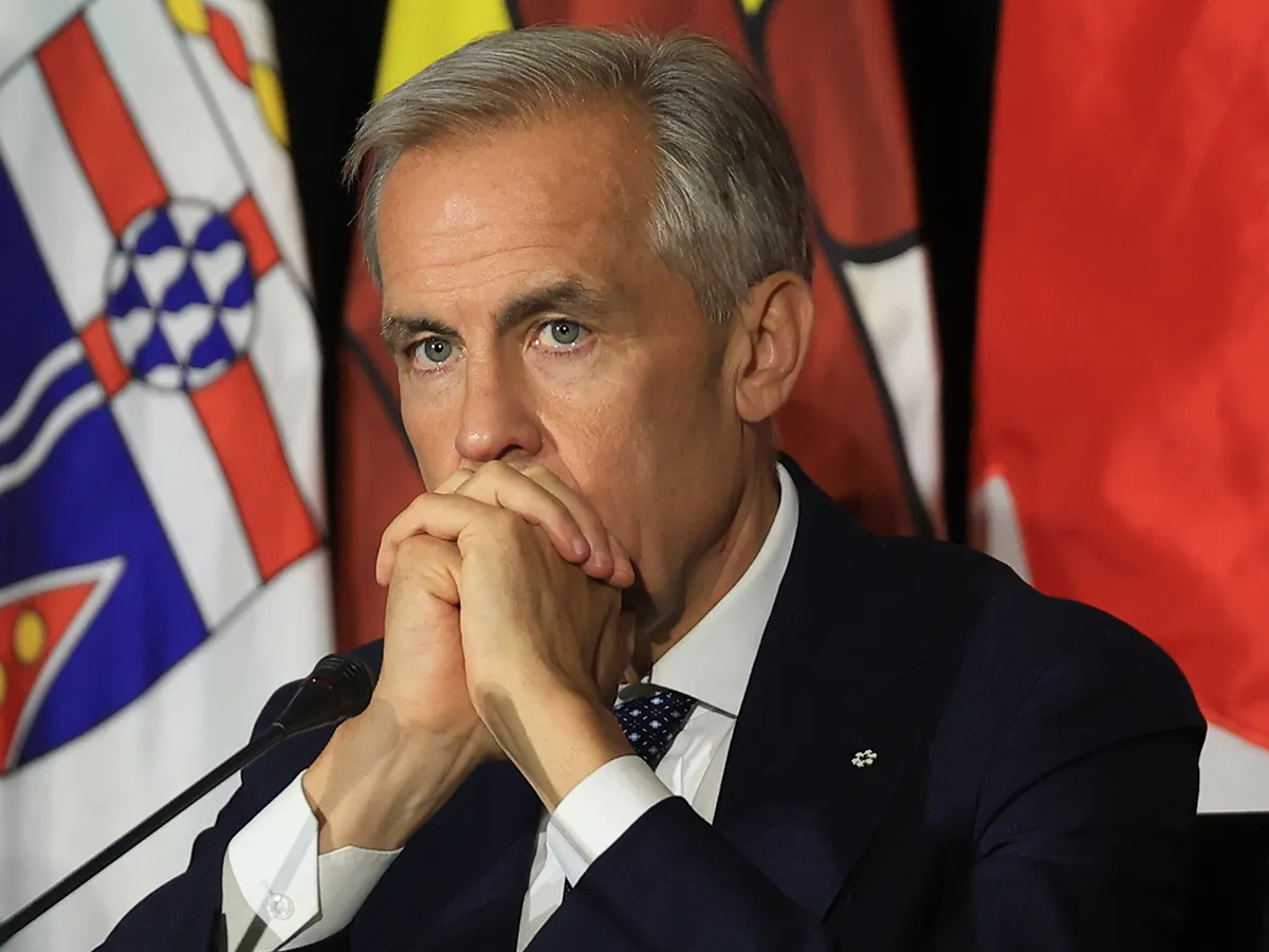 Canadian Prime Minister Mark Carney speaking to reporters in Charlottetown, Prince Edward Island.
