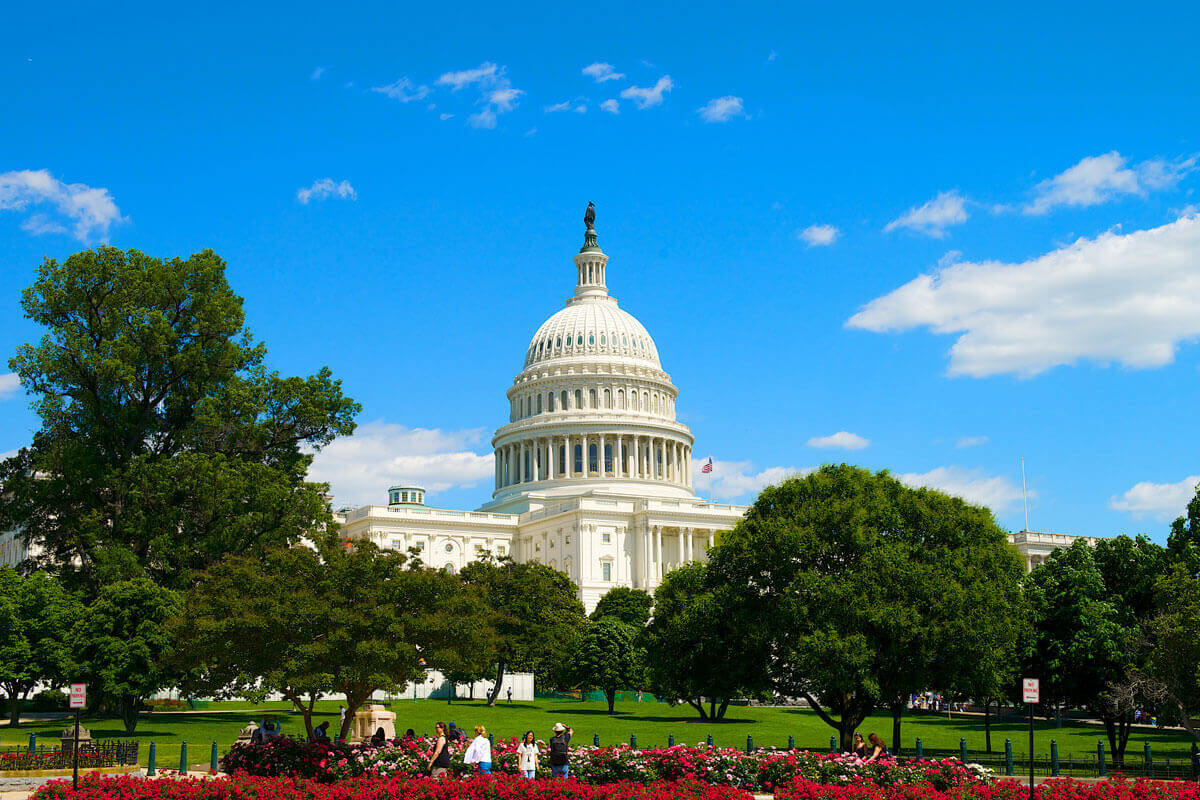 U.S. Capitol with a bitcoin token representing proposed cryptocurrency wash sale tax rules