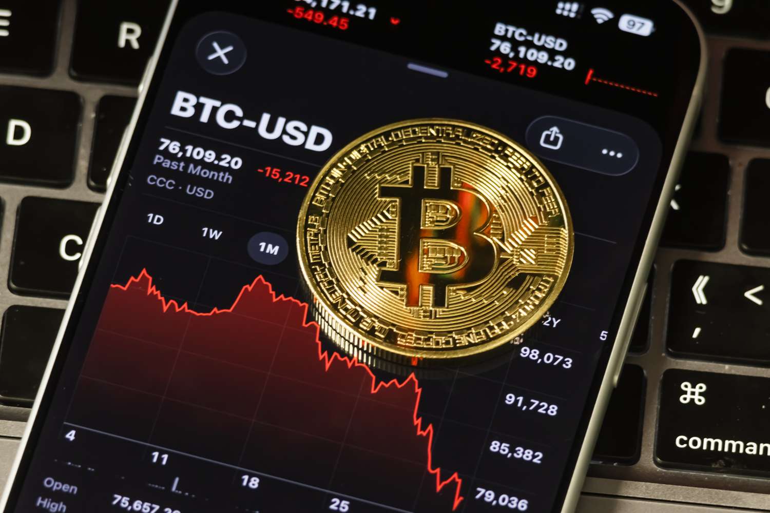 Illustration of a cracked bitcoin coin descending along a falling trading-volume chart line toward a row of closed exchange shutters, symbolizing crypto exchange closures amid a 25-month low in trading volume.