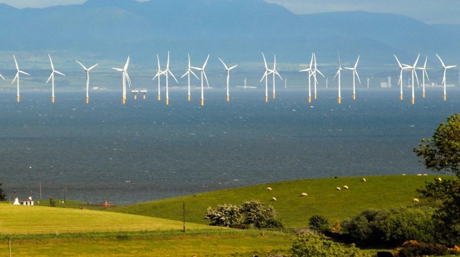 Offshore wind turbines representing UK energy investment and renewable energy infrastructure.