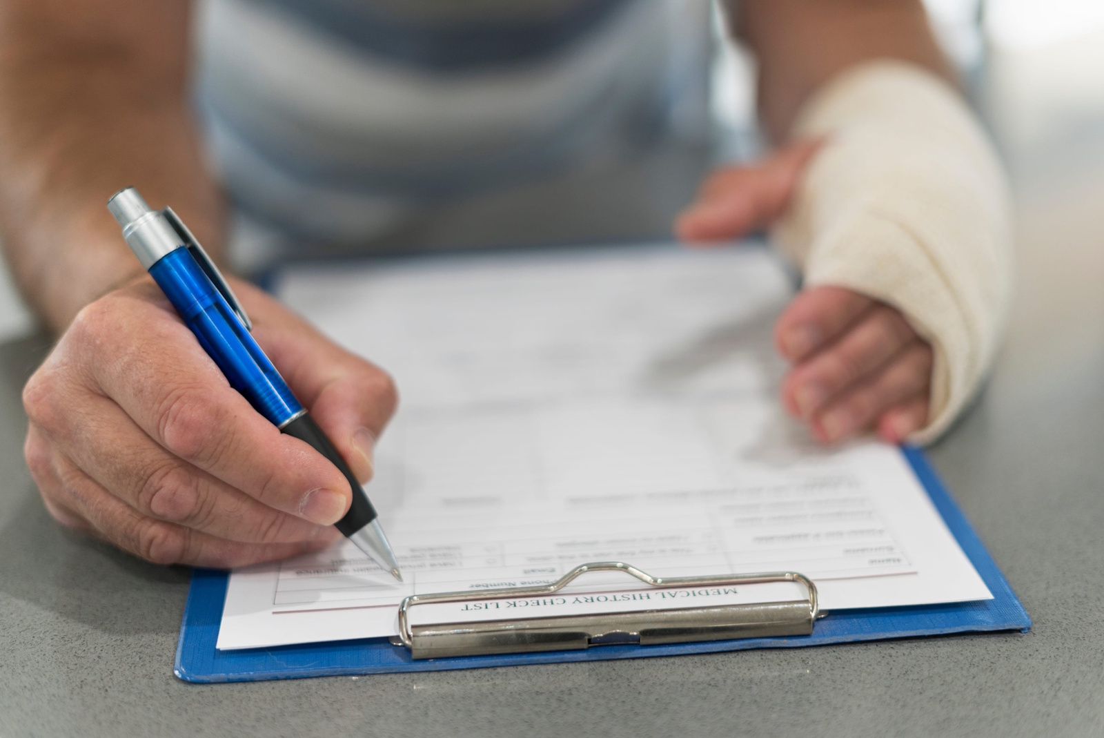 Injured person reviewing a personal injury claim with a legal adviser