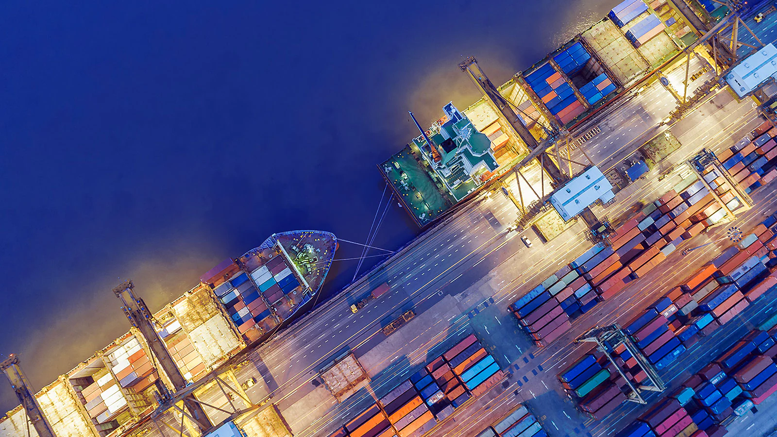 Container ships and cargo terminal representing global supply chains and supplier finance