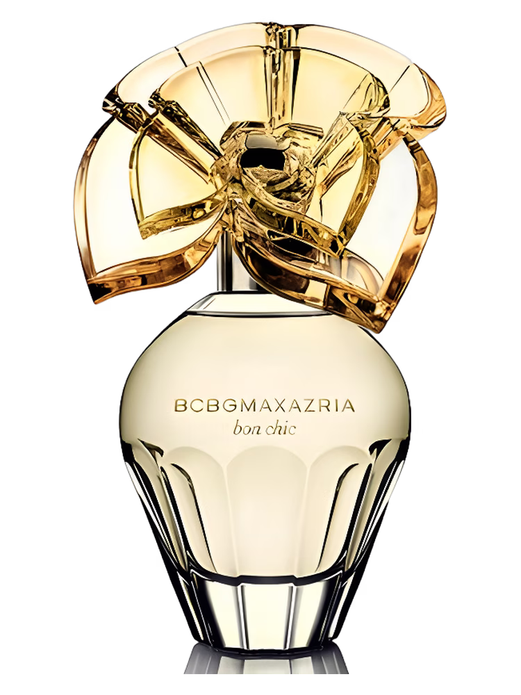 BCBGMAXAZRIA Bon Chic perfume bottle featuring a pale gold finish and sculptural gold cap against a black background.